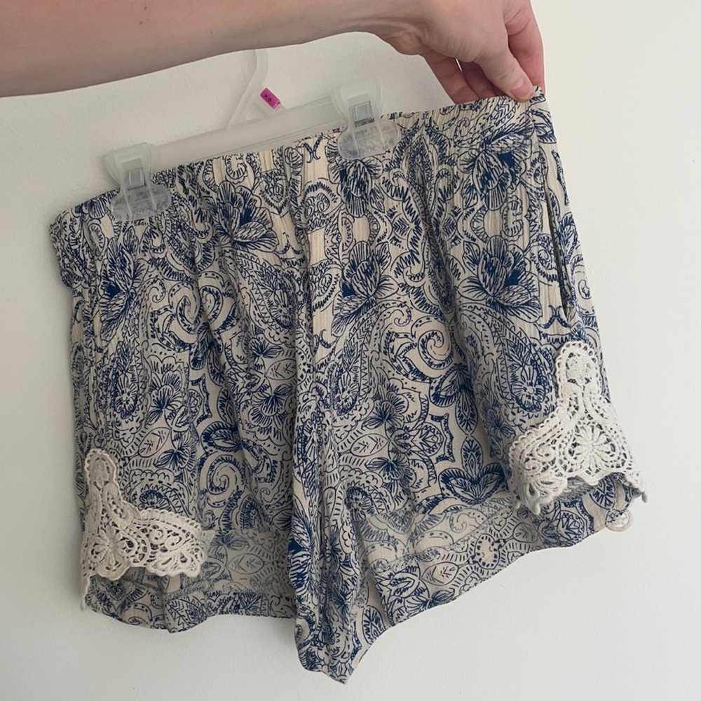 Adorable cream and navy shorts with crochet sides